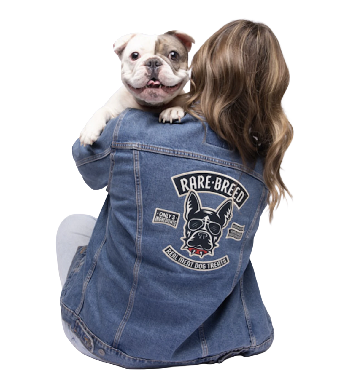 Chini, a shelter dog, held by a Rare Breed supporter